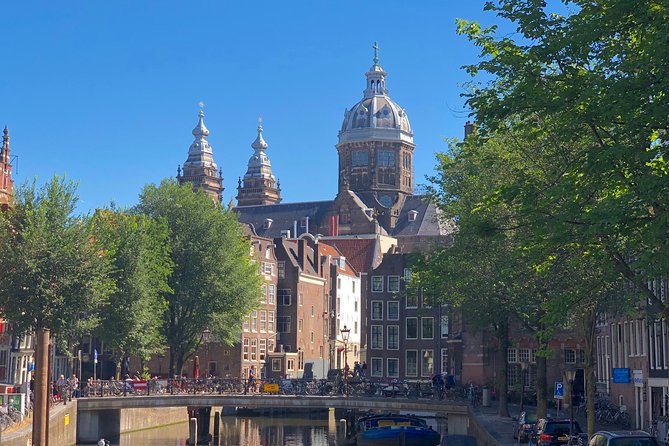 Absolutely Amsterdam - the Essential Introductory Walking Tour - Oostindisch Huis: the Golden Age trade hub, and the darker legacy that comes with it