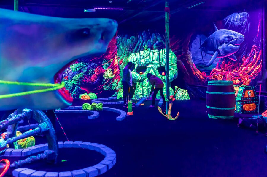 Aloha Amsterdam: 12-Hole Glow-in-the-Dark Mini-Golf - Entering the course: pirates on ships meets an underwater world