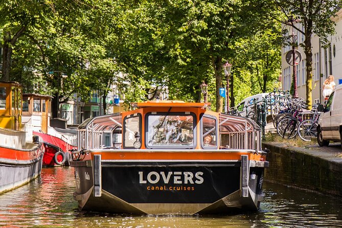 Amsterdam 1h Canal Cruise by Semi-Open Boat with Audio Guide - Red Light District pass and why the canal angle is different