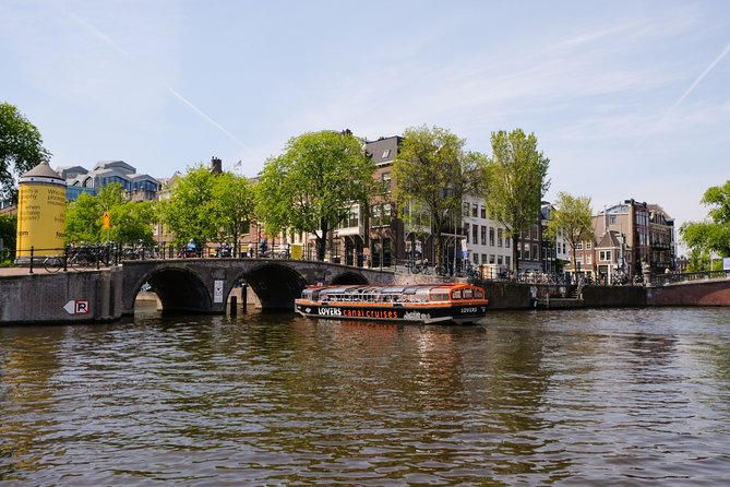 Amsterdam 1h Canal Cruise by Semi-Open Boat with Audio Guide - Magere Brug, skinny silhouette, classic bridge vibes