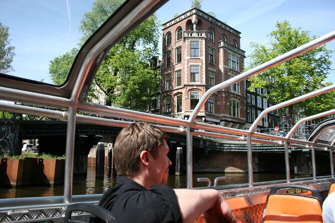 Amsterdam 1h Canal Cruise by Semi-Open Boat with Audio Guide - The 1-hour route and what you’ll notice along the way