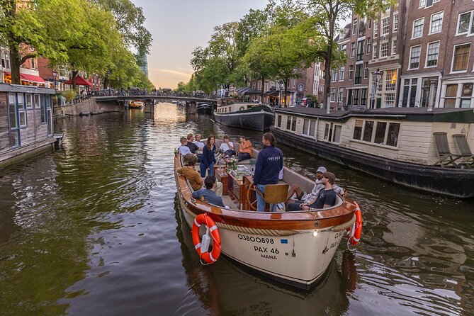 Amsterdam 2 Hour Small-Group Canal Cruise with Dutch Snacks & Bar - Snacks, bar access, and how to make the onboard time feel worth it