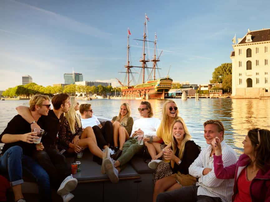 Amsterdam: 90 min Cruise with Local Guide & Unlimited Drinks - 1.5 hours on the canals: comfort, weather reality, and how the ride works