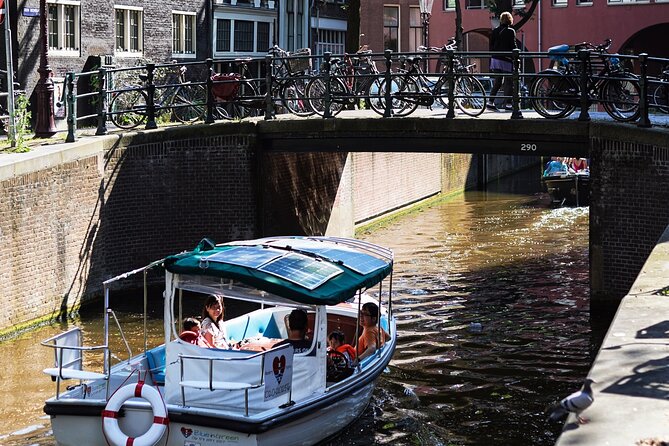 Amsterdam 90-min Private Canal Cruise with Live Guide and Drinks - Jordaan at night: a quieter Amsterdam with postcard bridges