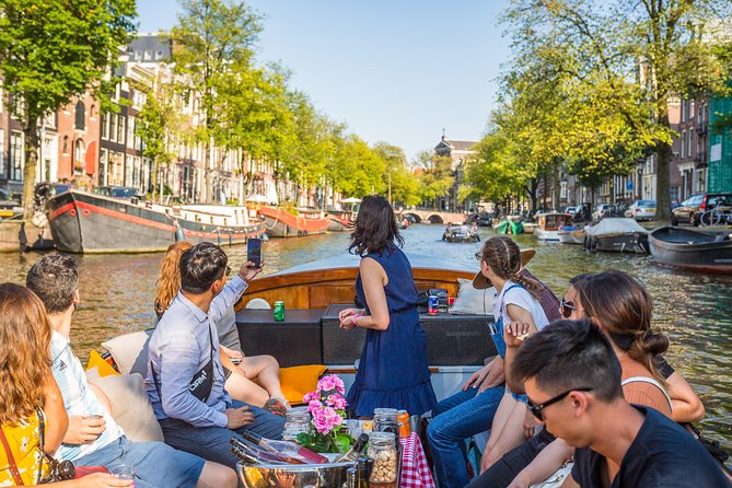 Amsterdam All-Inclusive 90-Minutes Heated Cruise by Captain Jack - Unlimited Heineken beer and wine, plus Dutch snacks