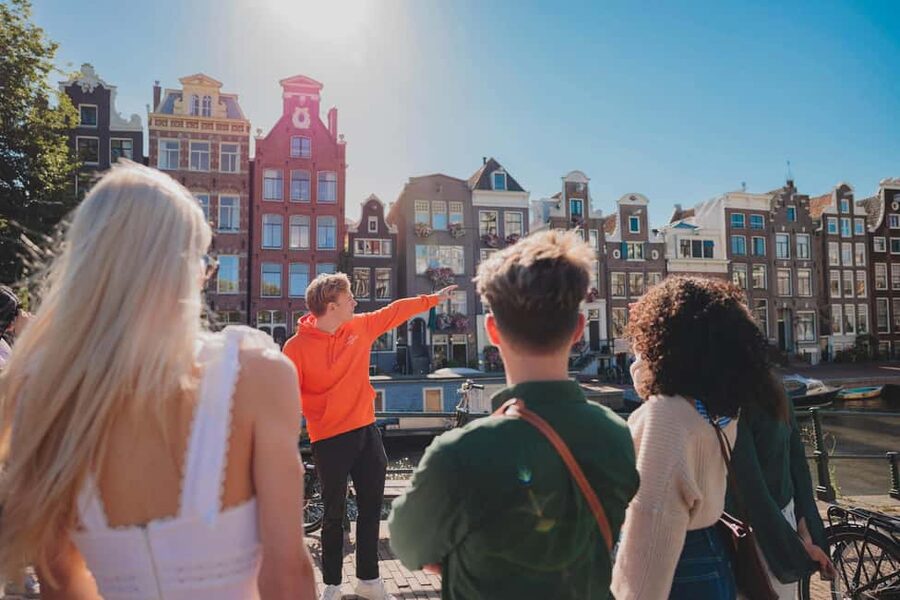 Amsterdam: Anne Frank History Walking Tour - Westerkerk Bells, the Anne Frank House Exterior, and Dam Square’s Shift