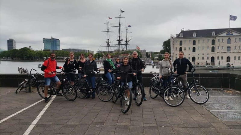 Amsterdam bike tour with a French-speaking guide local! - Dam Square: where Amsterdam’s center of gravity becomes real