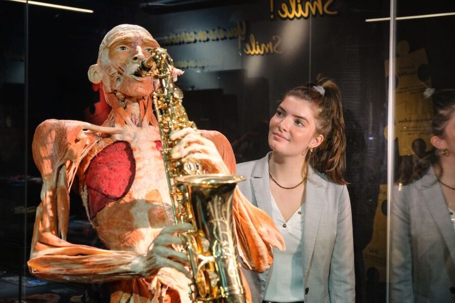 Amsterdam: Body Worlds Exhibition and Canal Cruise - Inside the museum, more than 200 specimens and the happiness angle
