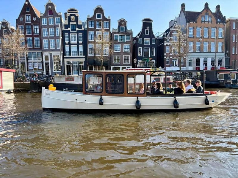 Amsterdam Canal Boat Tour with Live Guide - Timing your cruise: daytime comfort vs evening atmosphere