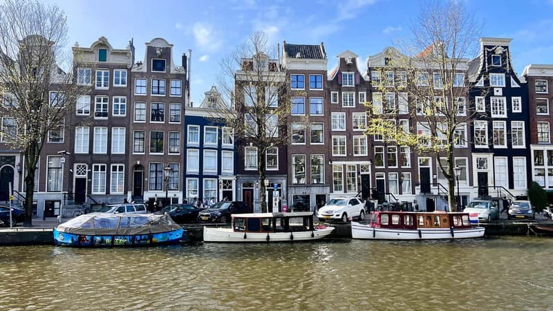 Amsterdam Canal Boat Tour with Live Guide - Where you meet: Oudezijds Voorburgwal dock near Saint Morris Restaurant