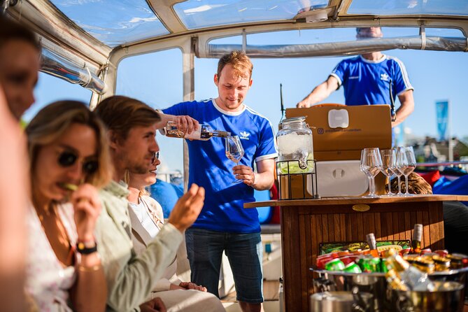 Amsterdam: Canal Booze Cruise with Unlimited Drinks Option - Weather reality check: covered boats help, but bring comfort