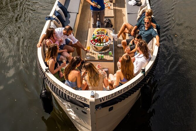 Amsterdam: Canal Booze Cruise with Unlimited Drinks Option - Light Festival stop: 20 minutes of art included