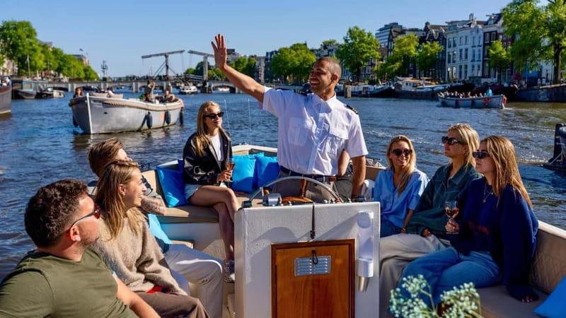 Amsterdam: Canal Cruise in Open Boat with Drink Option - Open-boat Amsterdam views, powered by a quiet electric motor