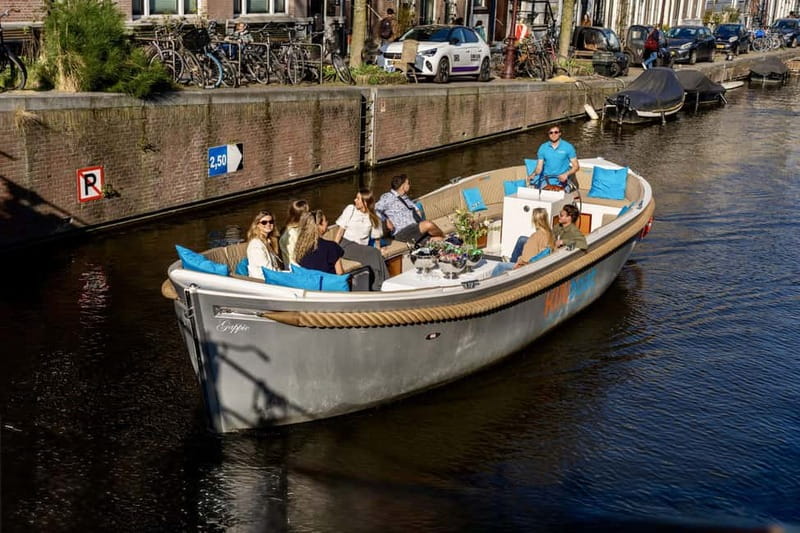 Amsterdam: Canal Cruise in Open Boat with Drink Option - Electric engine and comfort tips for an open-air ride