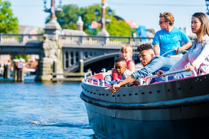 Amsterdam Canal Cruise in Open Boat with Unlimited Drinks Option - Your Guide and Captain Experience: From Funny Stories to On-Phone Moments