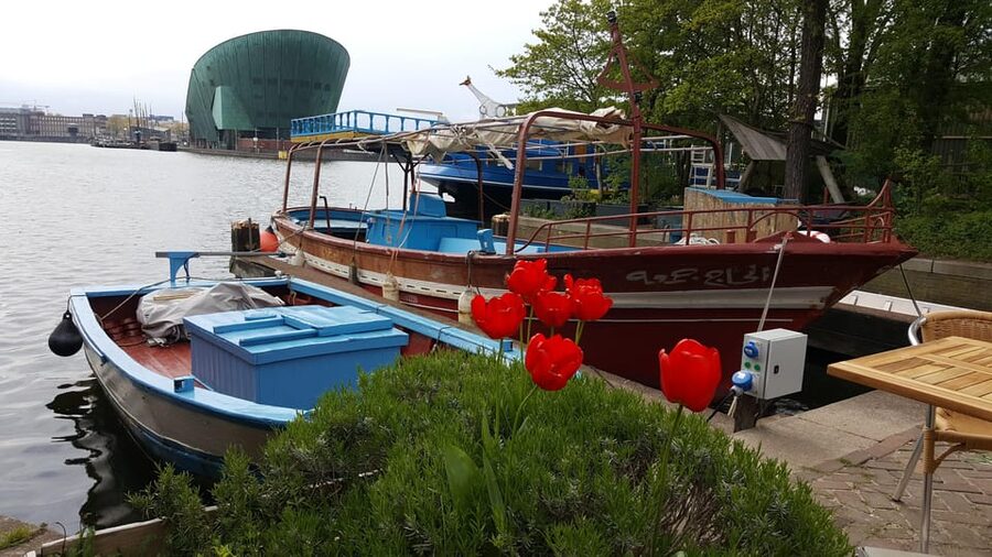 Amsterdam: Canal Cruise on a Wooden Refugee Boat - Smuggling routes and the fishing boat story you may not know