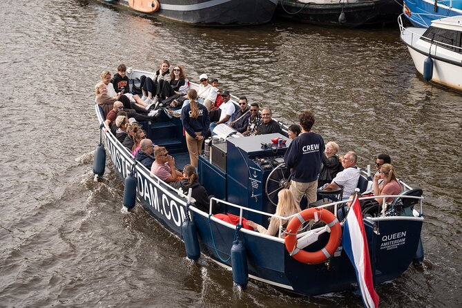 Amsterdam Canal Cruise with Live guide & Two drinks - Central St. - What You’ll See: Old Church, Central Station Area, and Canal Charm