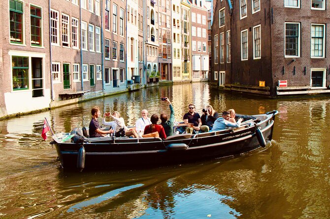 Amsterdam Canal Tour by Open Boat – 90 min Small Group Experience - Amstel River hits early: dancing houses and leaning buildings