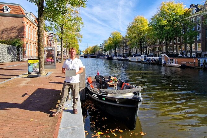 Amsterdam Canal Tour by Open Boat – 90 min Small Group Experience - Kolksluis and medieval locks still in use