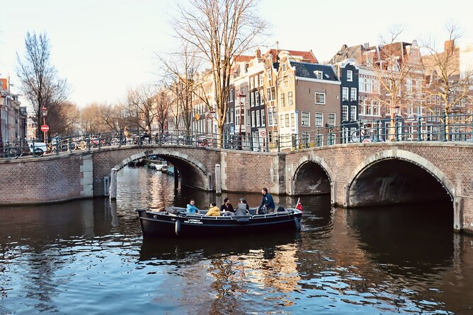 Amsterdam Canal Tour by Open Boat – 90 min Small Group Experience - Geldersekade to Nieuwmarkt: contrast, de Waag, and canal connections