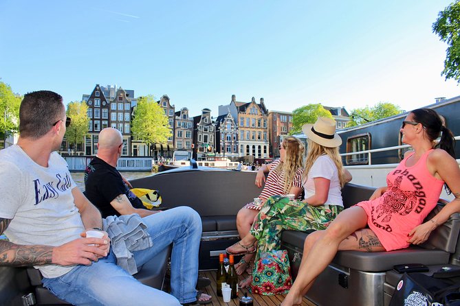 Amsterdam Canal Tour by Open Boat – 90 min Small Group Experience - Small-group comfort: max 12, blankets, and the open-boat reality