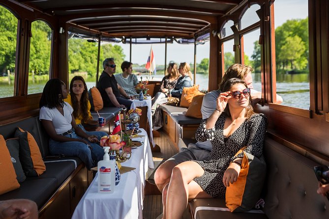 Amsterdam Classic Saloon Boat Cruise with Drinks and Cheese - Inside the Boat: Seating, Windows, and Noise Levels