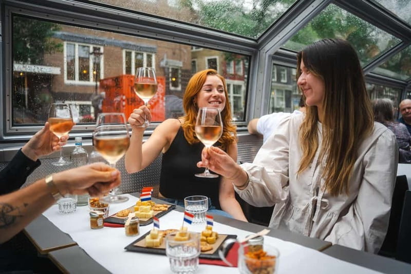 Amsterdam: Cozy Cheese & Wine Cruise Tasting Experience - Getting on at Damrak Pier 5: meeting point, seating rules, and onboard comfort