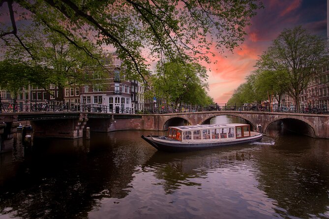 Amsterdam Evening Canal Cruise with Live Guide and Onboard Bar - A smooth way to learn Amsterdam after dark