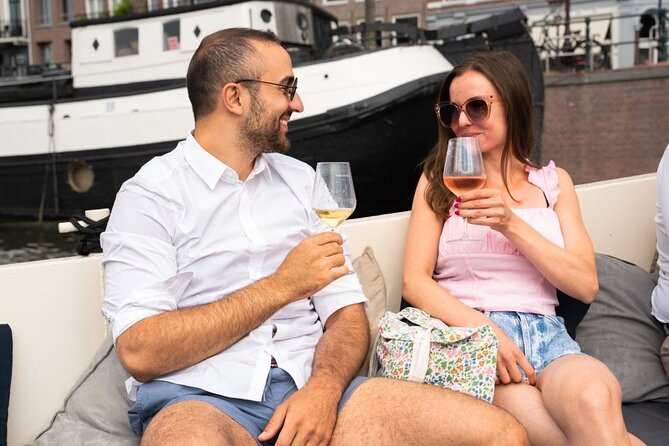 Amsterdam: Evening Candle Light Cruise With Wine & Cheese - Waterlooplein and the Stopera, two very different Amsterdam stories