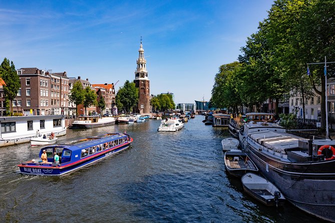 Amsterdam Family-Friendly Canal Cruise with Snackbox Option - Settling in on a covered canal boat, with room to breathe