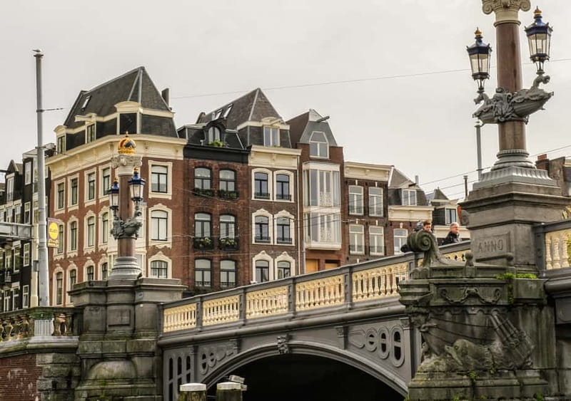 Amsterdam: German Canal Cruise with Unlimited Drinks Option - Modern boat, quieter ride, all-weather run