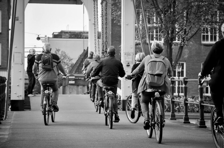 Amsterdam: Guided City Bike Tour in French - Key highlights worth knowing before you book