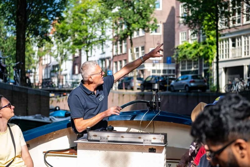 Amsterdam: Guided City Highlights Open Boat Canal Cruise - Key highlights to pay attention to