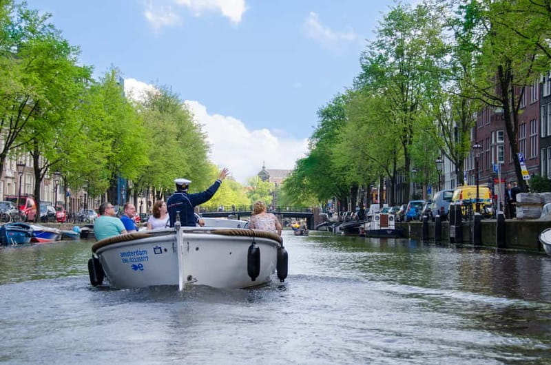 Amsterdam: Guided City Highlights Open Boat Canal Cruise - A small open boat, and why that matters in Amsterdam