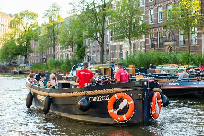 Amsterdam: Guided Open Boat Canal Cruise Unlimited Drinks Option - Drinks onboard: making the unlimited option feel like a win, not a distraction