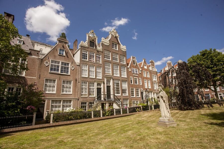 Amsterdam: Hidden Gems & Highlights Guided Bike Tour - Café Break Power: Local Snacks Without the Tourist Trap