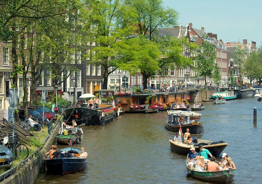 Amsterdam: Historic Walking Tour - The former main post office and the canal district origin story