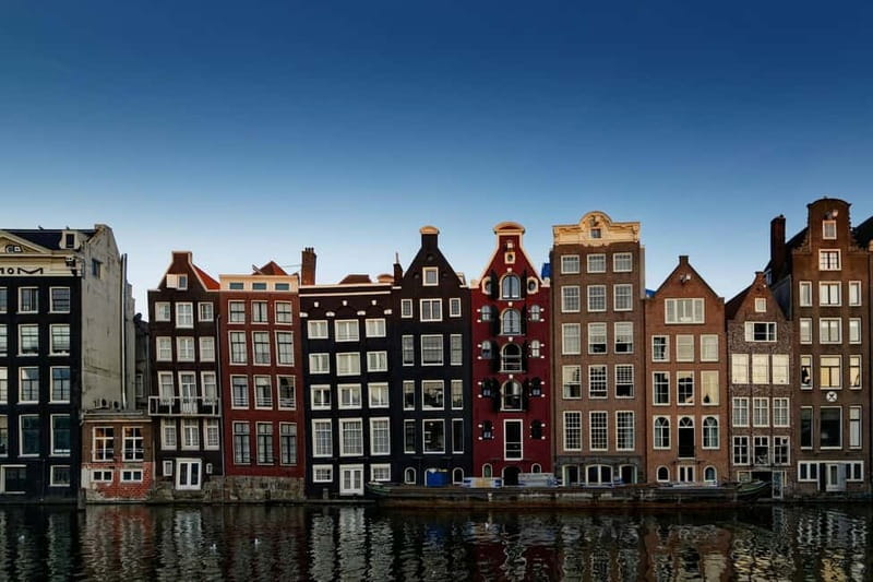 Amsterdam: Iconic Canals & Historic Sights Walking Tour - Jewish Quarter and wartime resilience: history with weight, not heaviness