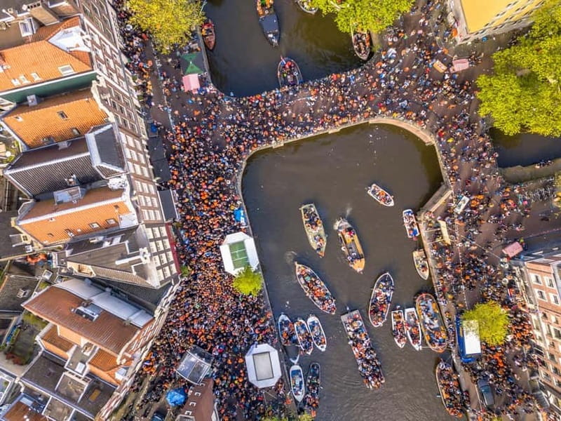 Amsterdam: Kings Day Boat Party with Unlimited Drinks - Canal views plus a guide, not just a party floating by