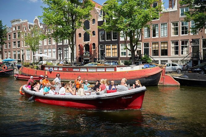 Amsterdam Light Festival: Saloon Boat Cruise + Hot Drinks & Bite - Boarding by the National Maritime Museum: timing and what you need to know
