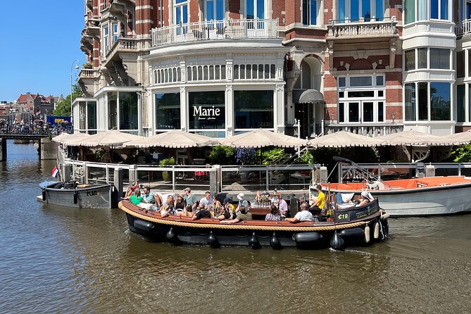 Amsterdam Luxury Boutique Boat tour with Unlimited Beer and Wine - Small-group energy and guide style, from Justin to Butter to Ben