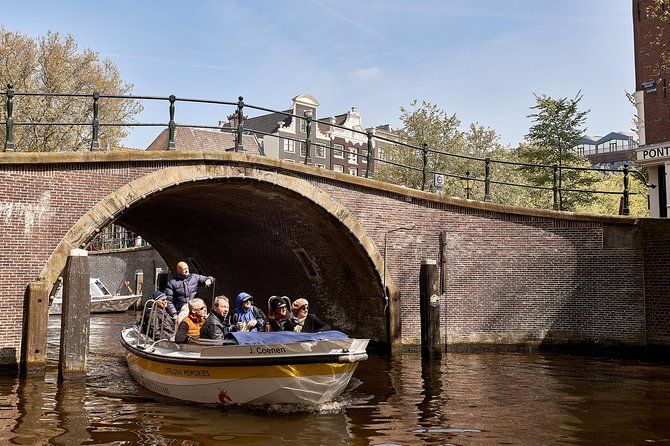 Amsterdam Open Boat Tour with Local Guide - The Captain-Guide Experience: Hearing the City Without Earbuds