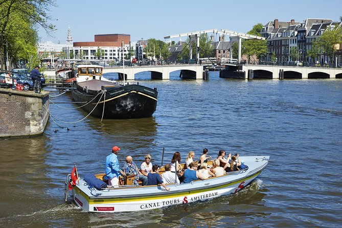 Amsterdam Open Boat Tour with Local Guide - Your One-Hour Route: Historic Canals, Love Bridge, and the Seven Bridges View