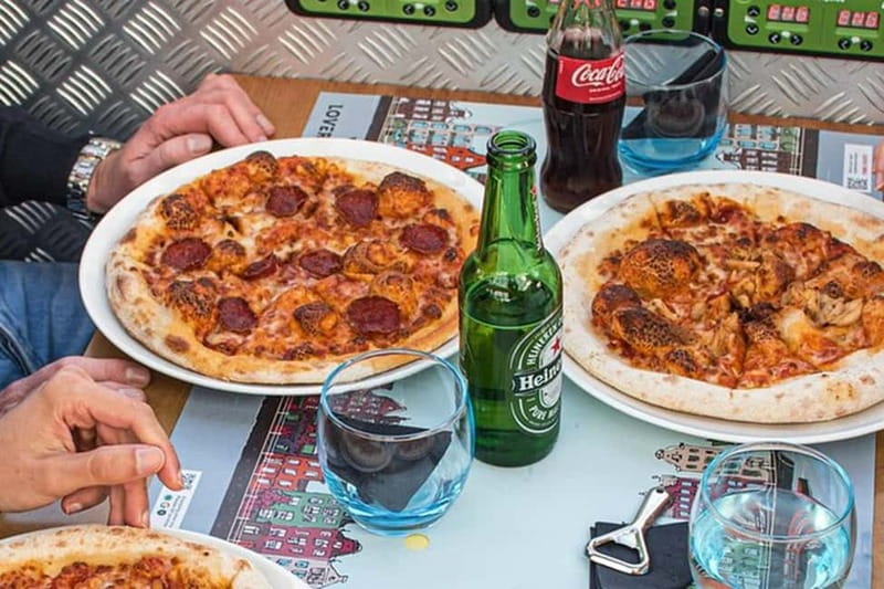 Amsterdam: Pizza Cruise with New York Pizza & Drinks - A 75-minute Amsterdam evening that mixes canals and comfort food