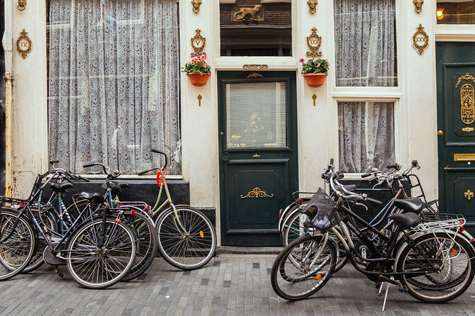 Amsterdam PRIVATE Bike Tour With Locals: Bike & Local Snack Included - Stop 1: Westerkerk, a church you can photograph without killing your day
