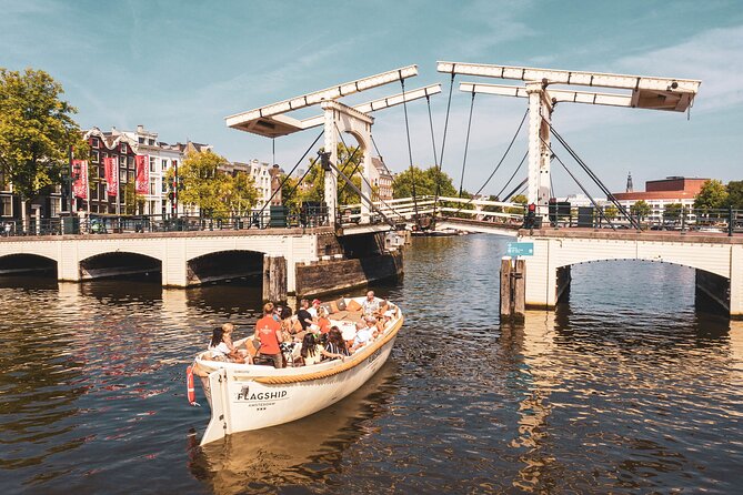 Amsterdam Private Boat Tour with Unlimited Drinks - Where you meet at Oosterdokskade 8, and why it helps your day