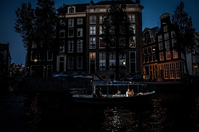 Amsterdam: Private Romantic Evening Canal Cruise + Bubbles/Snacks - Start in quiet canals, then glide under Seven Bridges all lit up