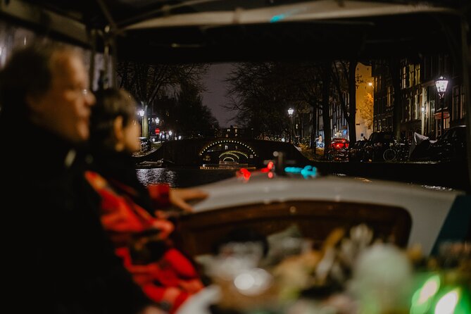 Amsterdam: Private Romantic Evening Canal Cruise + Bubbles/Snacks - Torensluis Bridge, Amsterdam’s oldest wide bridge, and small-house trivia