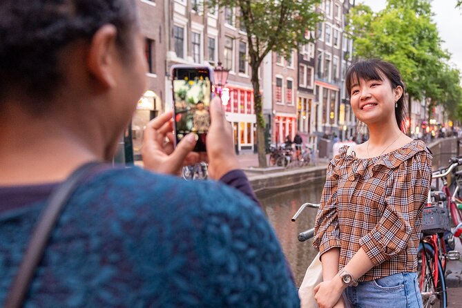Amsterdam Red Light District Walking Tour in EN/DE/IT/ES - National Monument and Condomerie: Start With Context, Not Shock