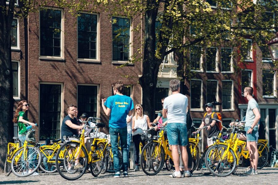 Amsterdam: Relaxed City Highlights Guided Bike Tour - Starting at Mokum: Nieuwezijds Kolk 29 and your bike intro